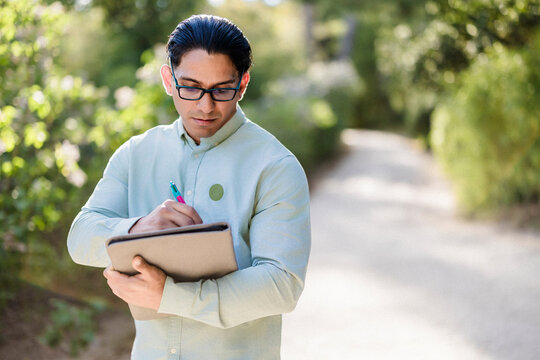 Latino man studying outdoors representing diversity and inclusion