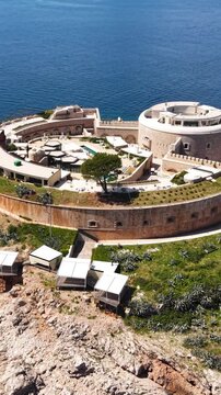 Vertical Drone Shot of Mamula Island, Montenegro, Former Fortress Now Luxury Resort Location