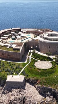 Vertical Drone Shot fo Mamula Island, Montenegro. Former Fortress Now Luxury Resort