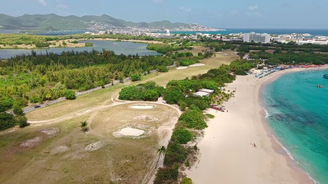 Sint Maarten Island, Caribbean Sea. Drone Shot of Mullet Bay Beach and Simpson Bay Buildings
