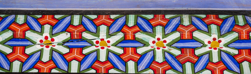 Colorful geometric dancheong pattern on traditional Korean wooden architecture. © 완수 안