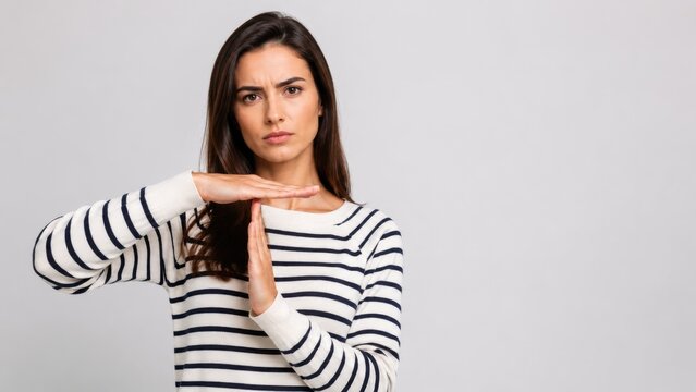 Serious Young Woman Making Timeout Gesture With Hands Isolated On Gray Background