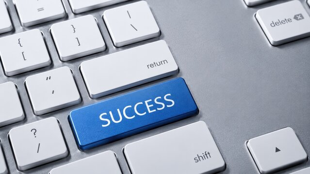 Blue Success Key on Computer Keyboard Symbolizing Achievement and Business Growth