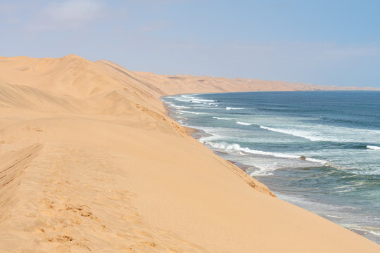The coastline and sand dunes on the edge of the Namib desert just south of Walvis Bay, Namibia, Africa