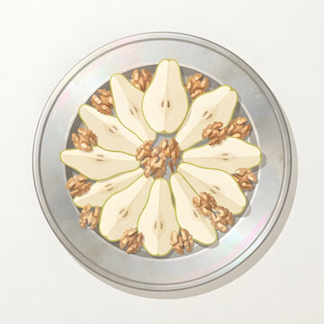 Sliced Pears and Walnuts on a Silver Platter