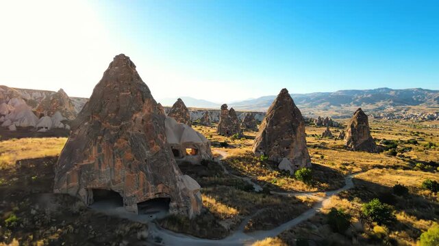 Aerial view of unique fairy chimney rock formations in cappadocia, turkey, with ancient cave dwellings