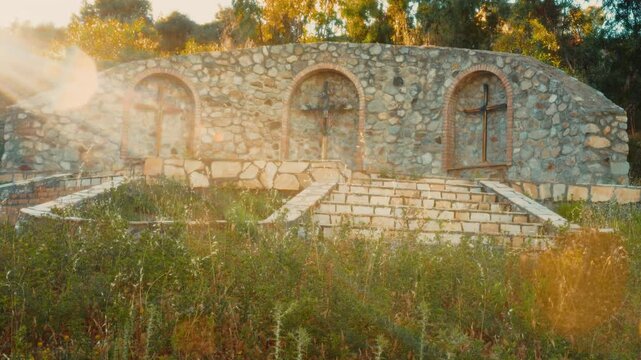 Three sacred Christian religious Jesus crucifixes in an Italian outdoor Calvary