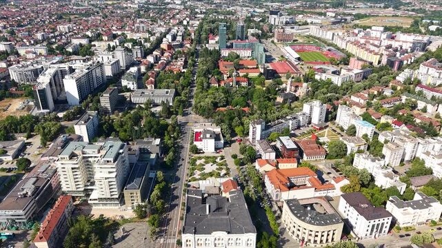 Banja Luka, Bosnia and Herzegovina, Drone Shot of Downtown Buildings, Orthodox and Catholic Church on Hot Sunny Day
