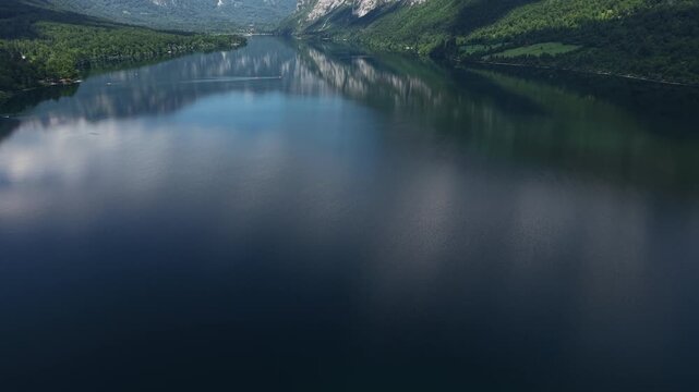 Aerial View of Bohinj Lake, Slovenia. Stunning Mountain Landscape and Glacial Water Reflections, Revealing Drone Shot