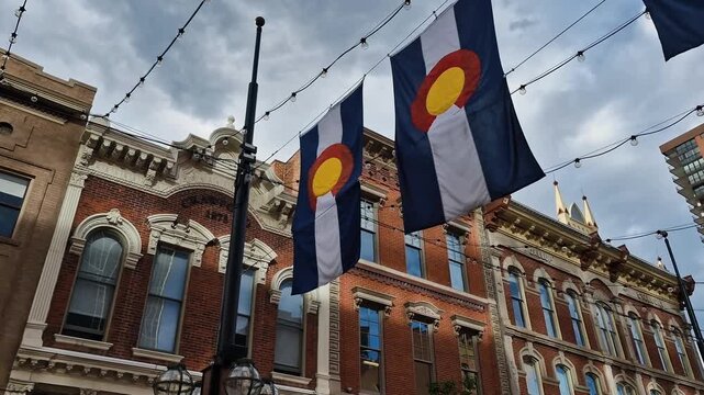 Colorado State Flags Hanging Between Historic Buildings on Larimer Square, Downtown Denver USA