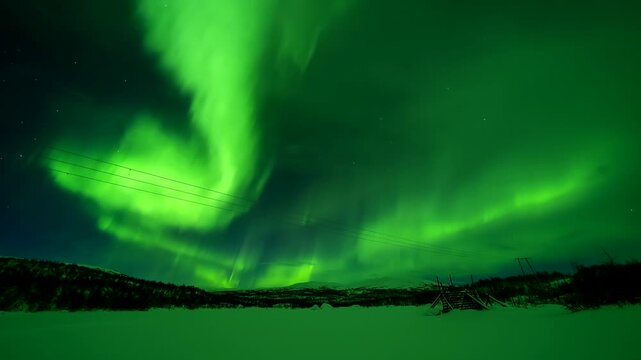 Aurora borealis stretches across the night sky over snowy Finland beneath bright stars, dancing until cloud cover hides the sky