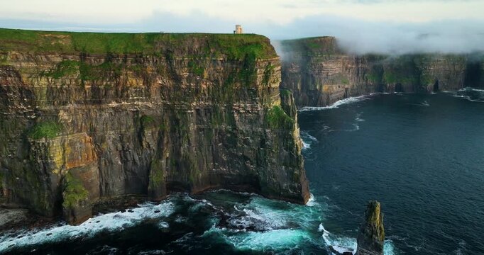 Cliffs of Moher with O'Brien's Tower and sea stack at sunrise, County Clare, Ireland