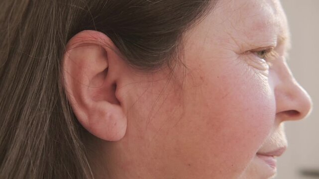 unhappy Mature woman holding painful ear, agony earache grimace, suffering health problems, sharp pain issue, ringing auditory hallucinations, hearing perception, mental health, unusual sounds