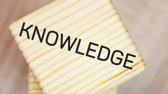 KNOWLEDGE text, word on high cubes. Acquiring knowledge, possessing a skill, knowledge, concept,animation