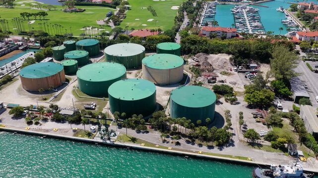 Factory tank with oil or fuel. Environment and ecology concept. Oil refinery storage. Fuel storage facility. Petroleum industry aerial view, 4k. Fuel storage tank with petroleum in industrial area