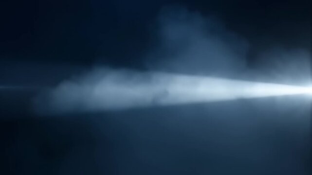 A streak of light cuts through darkness with a beam of white smoke
