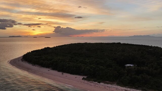 Drone view of sunset light on an island beach, Serenity Island, Fiji