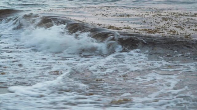 waves crashing on beach 
