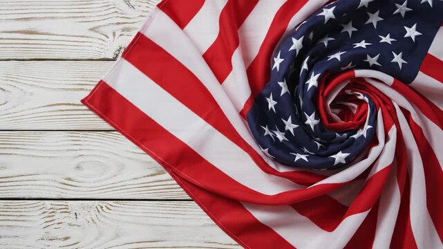 American flag unfolding on wooden background