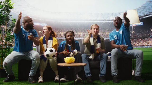 Football supporters hold beer cups and a ball while watching a match broadcast, feeling inside the stadium as soccer fans drink and eat chips at home.