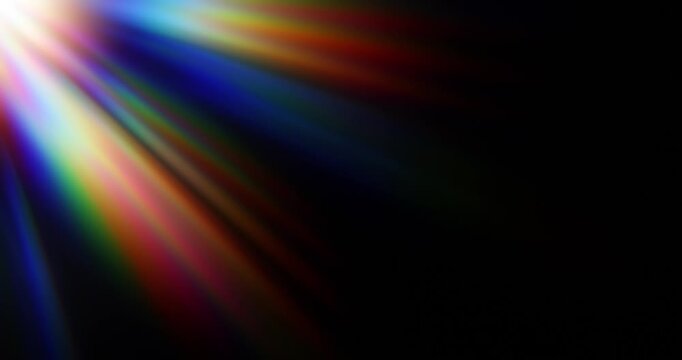 Light shining into a prism creating lens flare in a vivid rainbow of random dancing light rays. Optical effect of a light refraction creating chromatic aberration in a spectrum colors. Seamless Loop.