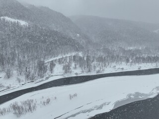 Partially Frozen Teshio River During a Snowstorm in Northern Hokkaido, Japan – Aerial Drone Footage © Doggy Drone
