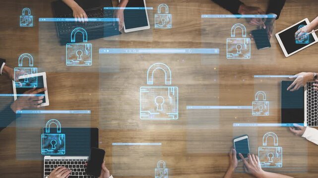Collaborative Technology Meeting Focused on Cybersecurity and Data Protection with Digital Lock Icons Surrounding Laptops and Tablets on Wooden Table. Entropy.