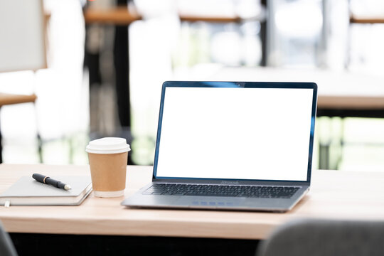 Laptop Mockup on Wooden Table in Cafe