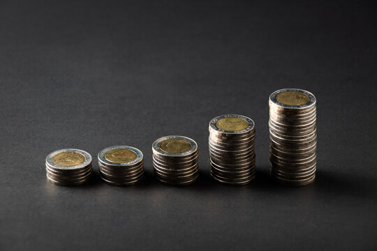 Stacks of Coins on Dark Background for Savings, Investment and Financial Growth Concept