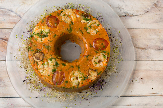 Traditional Brazilian cuscuz paulista savory cornmeal cake.