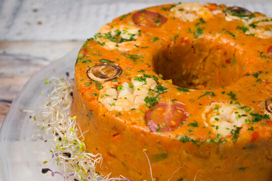 Traditional Brazilian cuscuz paulista savory cornmeal cake.