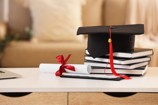 Graduation cap with red tassel and diploma scroll on a stack of books academic achievement and future success, this arrangement academic achievement the culmination of higher education