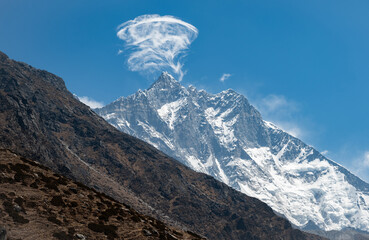 Naklejka premium Dramatic clouds floting on Mt.Lhotse the fourth highest mountain in the world at 8,516 metres can seen along the way to Everest base camp in Nepal.