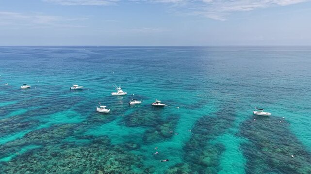 Overlooking boats moored along the reef at Sombrero Key Lighthouse offshore near Marathon in the Florida Keys.