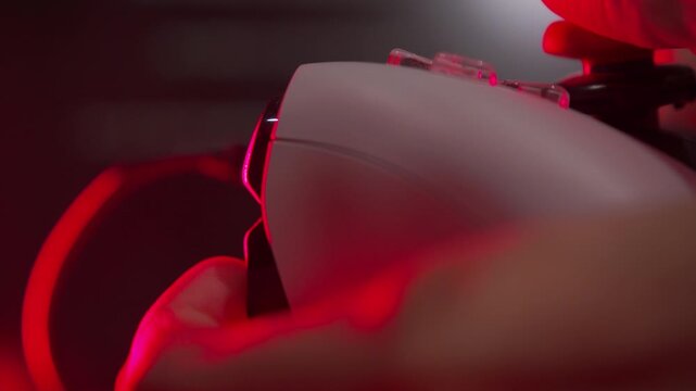 Close Up of a Gamer Hand Playing a Video Game by Pulling the Index Finger Trigger on a Controller