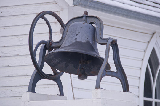 An old fashioned bell at an outdoor museum