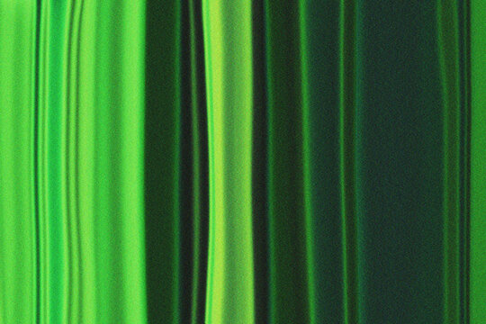 Dynamic vertical green stripes with a subtle grain texture creating a vibrant artistic pattern for backgrounds