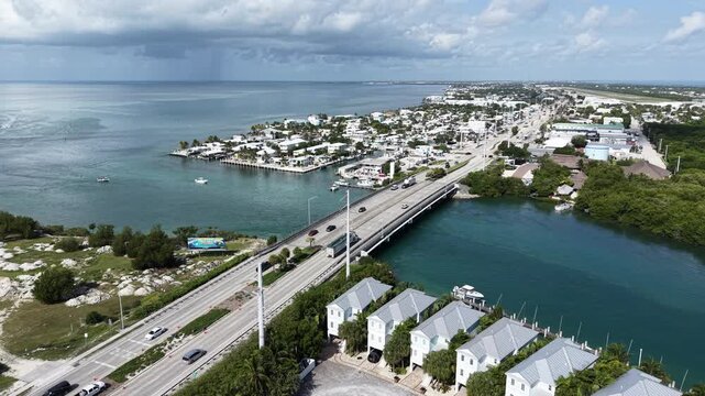 Aerial view of fishing boats heading through the Vaca Cut channel in the town of Marathon in Florida Keys