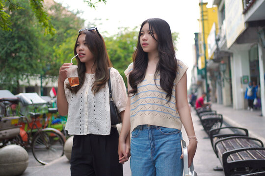 Young Women Walking Together at Malioboro Street Yogyakarta