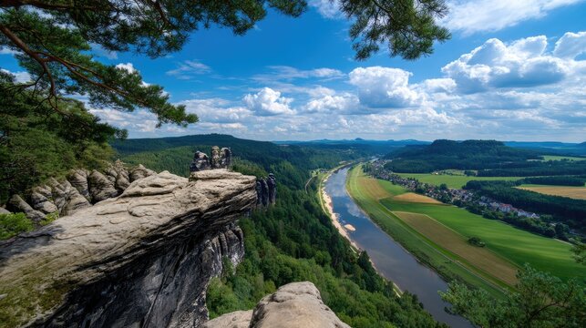 Breathtaking Aerial View of River and Lush Green Forests under Blue Sky with Fluffy Clouds