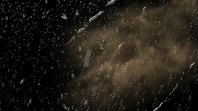 Raindrops on window glass during a storm. Wet surface with water droplets and dark moody atmosphere.