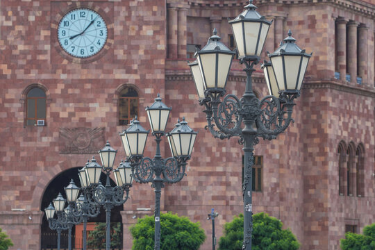 Republic Square clock tower and retro street lamps in Yerevan with copy space