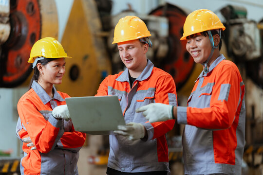 Team discusses safety measures in a factory during a work meeting