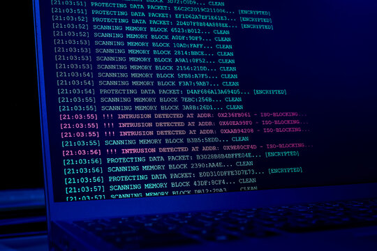 Laptop screen displaying cyber intrusion detected alert logs in terminal interface. Concept of hacking attack, network defense failure, cyber security breach, and data firewall monitoring.
