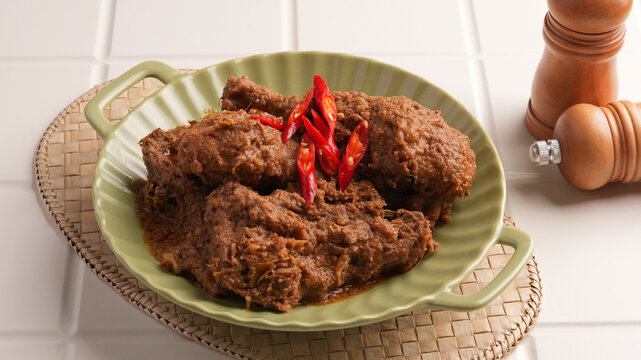 Rendang Ayam, traditional food from Padang, Indonesia. Chicken stew with spices, herbs and coconut milk