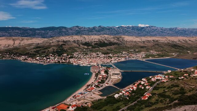 Pag town peninsula. Stone island in the Adriatic sea, Velebit mountains, Croatia, aerial view.