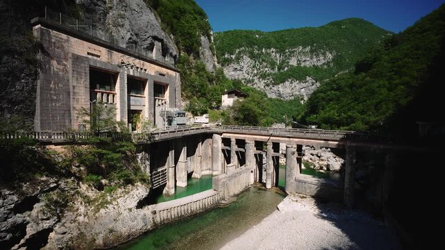 Vecchia diga di Barcis old dam and Edison historic hydroelectric station in Cellina gorge, Italy.