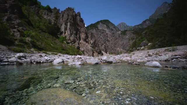 Andreis mountain river water flowing towards the camera, Friulian Dolomites, Northern Italy, low angle view.