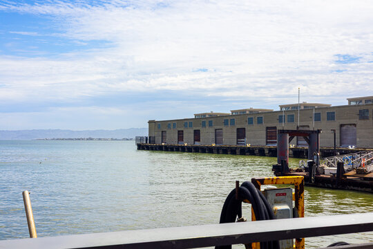 Pier Warehouse and Green Waters of San Francisco Bay