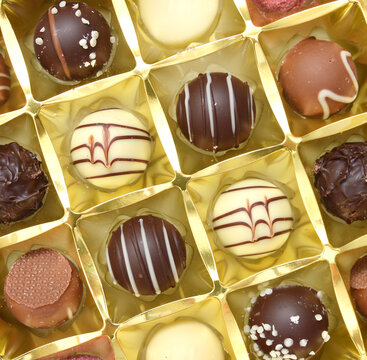 Chocolate candies collection. Beautiful Belgian truffles isolated on white background